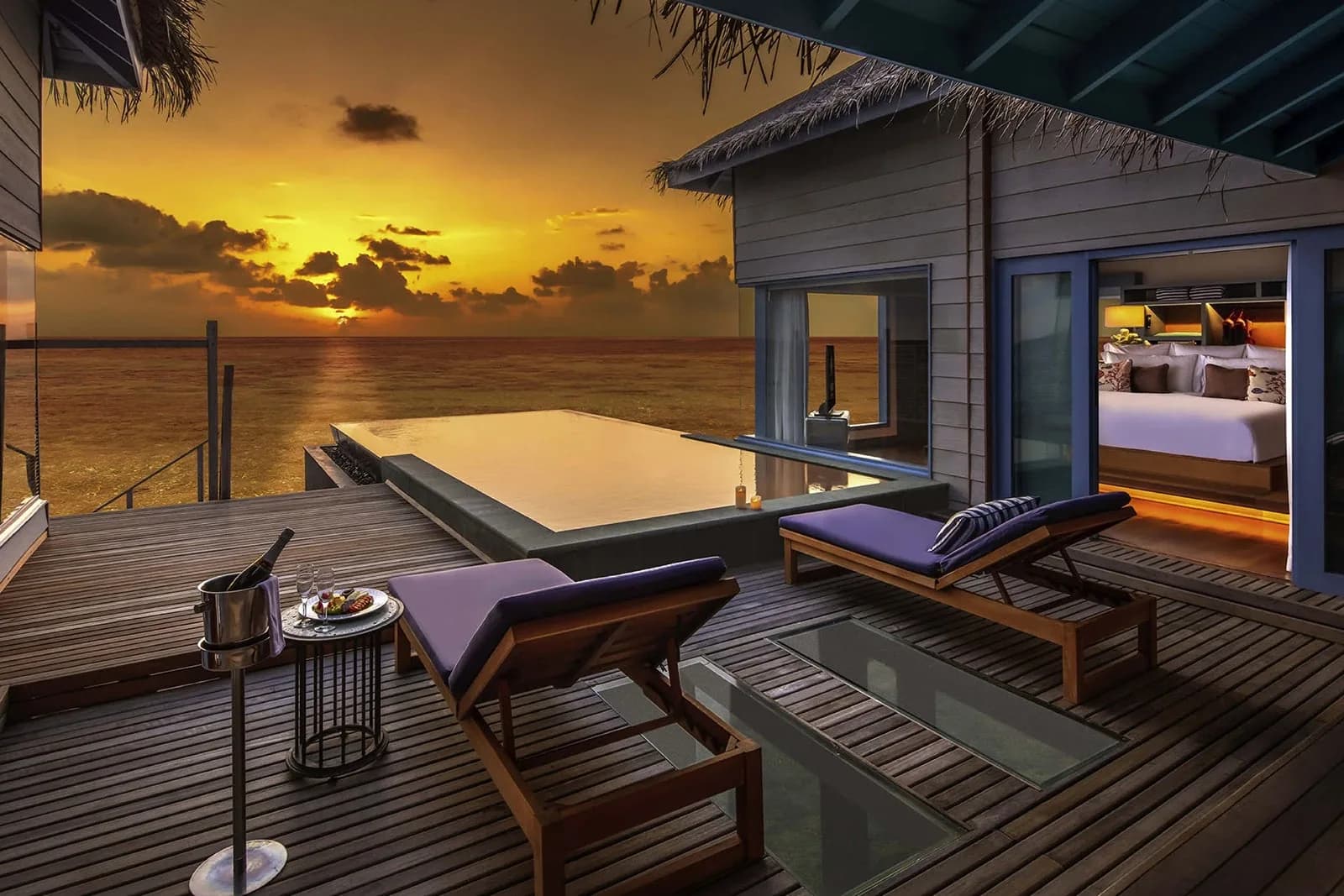 maldives honeymoon, Maldives, an over-water villa deck with an infinity pool at golden sunset