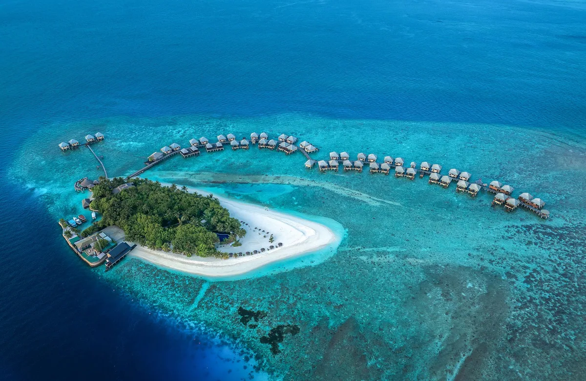 Adaaran Prestige Vadoo, aerial, South Malé Atoll, Maldives, Adaaran Prestige Vadoo, the Vaadhoo island geometry in northern South Malé Atoll with the all-over-water jetty cluster configuration and no beach-villa inventory by deliberate design.