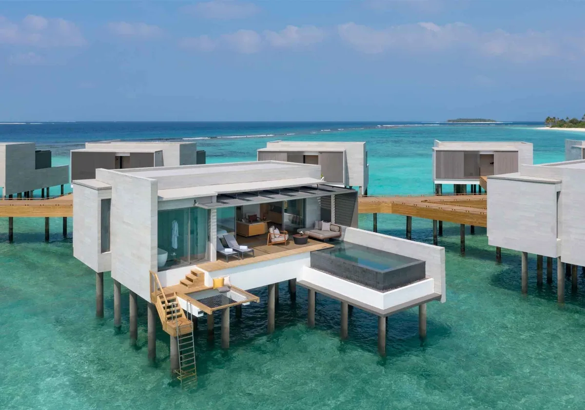 Alila Kothaifaru Maldives, Lagoon Aqua Pool Villa cubic textured-concrete overwater pavilion with infinity plunge pool over turquoise lagoon, Raa Atoll, Maldives