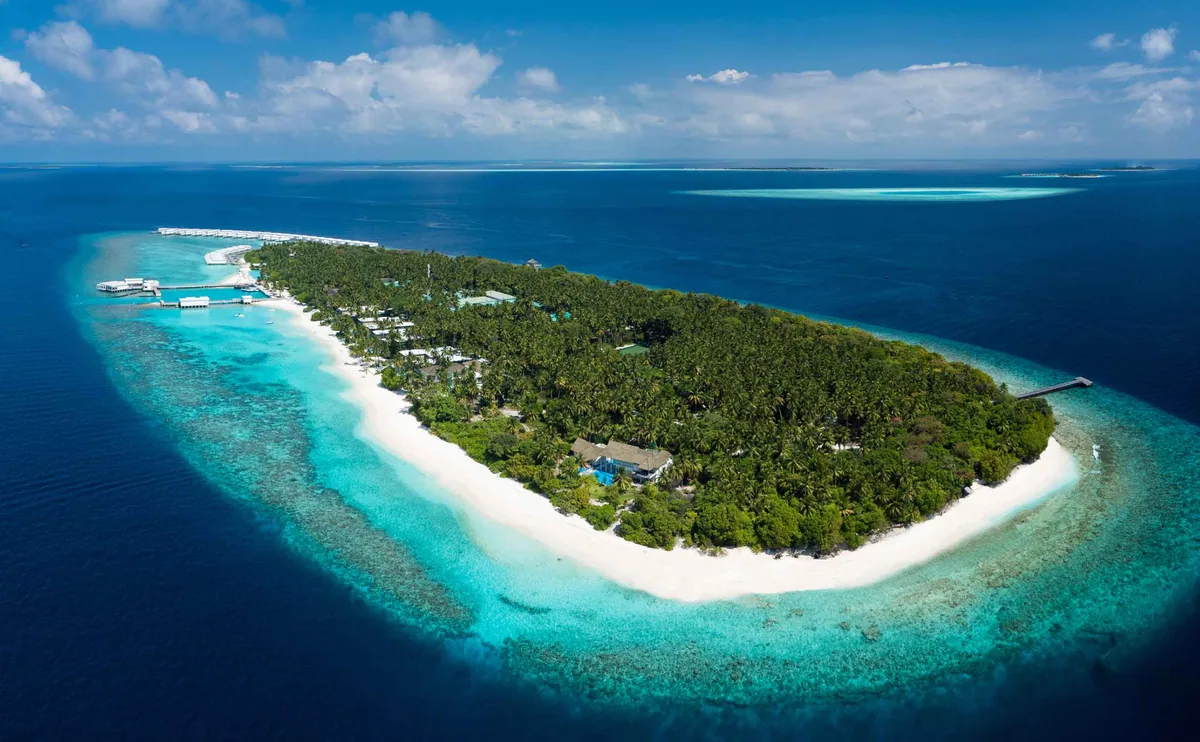 Amilla Maldives, aerial, Baa Atoll, Maldives, Amilla Maldives, the natural-island Amilla Fushi geometry in northern Baa Atoll UNESCO Biosphere Reserve with the multi-bedroom Great Beach Villa Residence cluster.