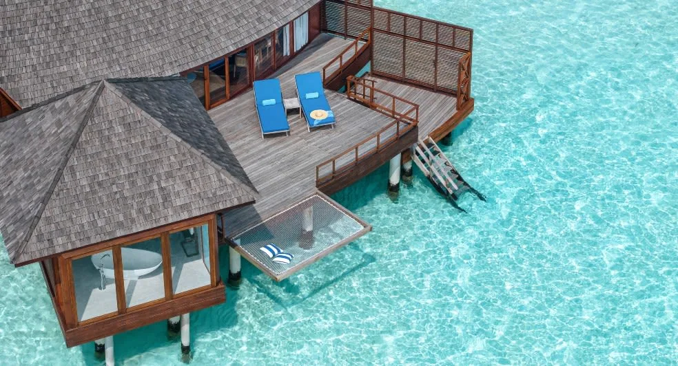 Anantara Dhigu Maldives Resort, villa overwater, South Malé Atoll, Maldives, Sunset Over Water Suite at the lagoon-side configuration.