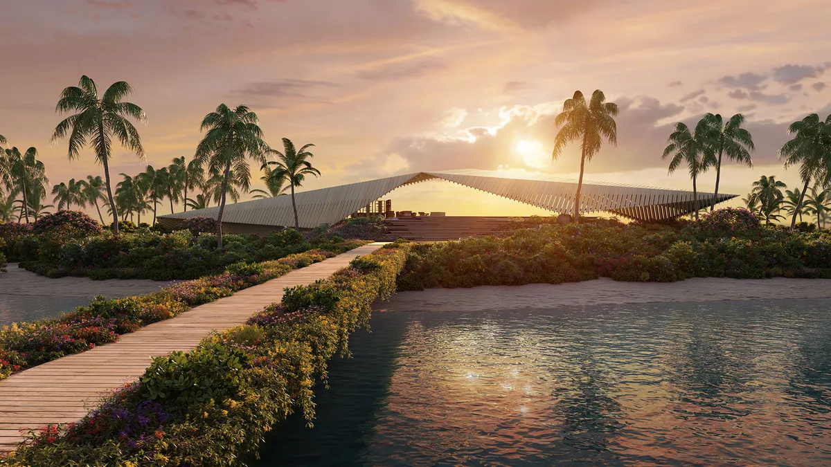 Capella Maldives, setting, North Malé Atoll, Maldives, Press rendering of the Kengo Kuma signature arrival pavilion at sunset: a low-slung wave-roof structure with layered timber slats catching the golden-hour light, boardwalk approach through landscaped tropical beds, lagoon-edge planting bringing the property's identity together in the cluster's largest single building.