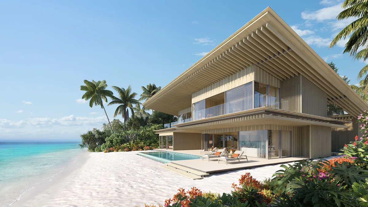 Capella Maldives, villa beach, North Malé Atoll, Maldives, Press rendering of a Beach Pool Villa by Kengo Kuma: two-storey pavilion with the architect's signature overhanging slatted timber roof, private rectangular plunge pool stepping into the white-sand beach foreground, ground-floor open-plan living with full-glass beach-facing walls, palm canopy framing both sides.