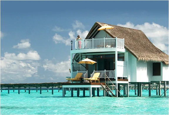 Centara Grand Island Resort & Spa Maldives, villa overwater, Alif Dhaal (South Ari) Atoll, Maldives, Reethi Muraka Suite, the property's two-story overwater suite signature with the upper deck and lagoon-edge plunge, the lagoon and reef visible across the lower deck.