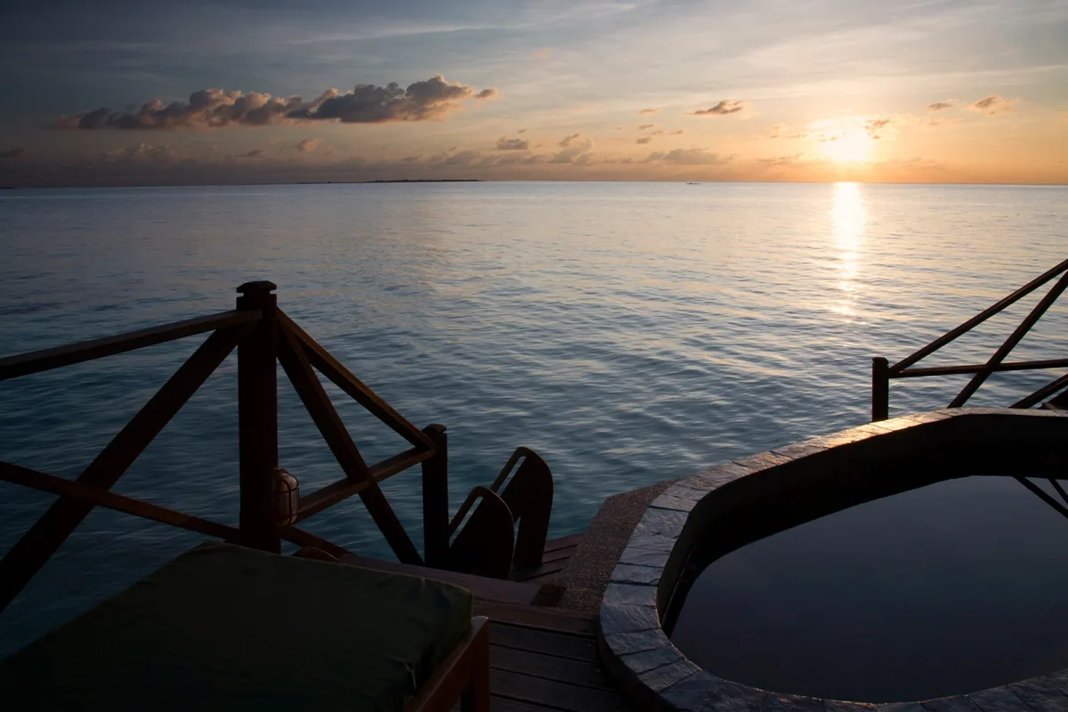 Coco Palm Dhuni Kolhu, villa beach, Baa Atoll, Maldives, Sunset Beach Villa with the tree-line positioning under the dense palm canopy.