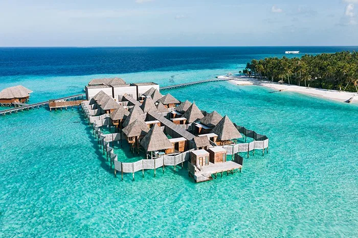 Conrad Maldives Rangali Island, spa, Alif Dhaal (South Ari) Atoll, Maldives, Spa Retreat aerial, the cluster of thatched-roof overwater treatment pavilions 100 metres off the tip of Rangalifinolhu, the country's first glass-floor spa platform.