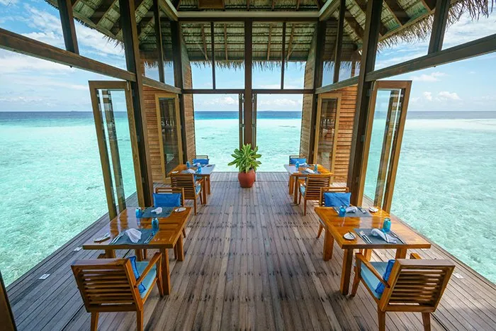 Conrad Maldives Rangali Island, dining, Alif Dhaal (South Ari) Atoll, Maldives, Mandhoo Spa Restaurant, the wellness-aligned dining pavilion on stilts at the tip of Rangali, open-air timber deck with the dietitian-aligned menu running alongside the spa programme.