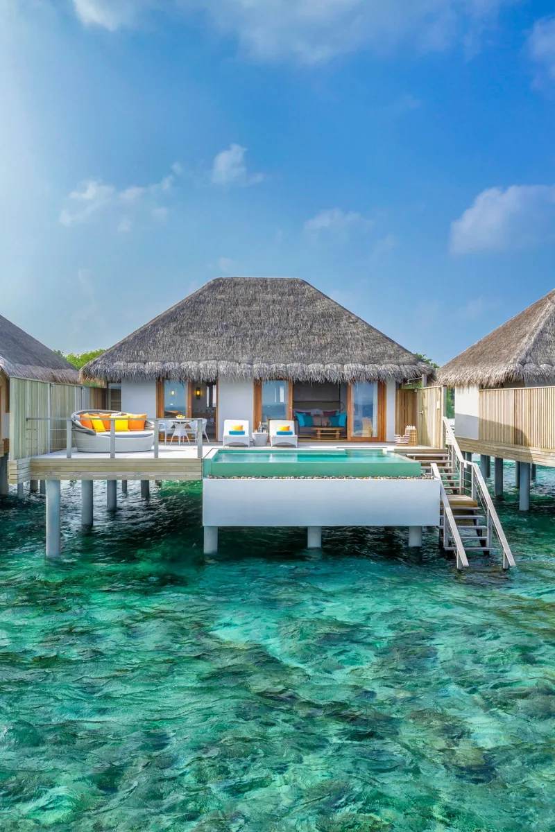 Dusit Thani Maldives, villa overwater, Baa Atoll, Maldives, Water Villa with the Thai-design vocabulary sloped roof lines and natural-material finishes.