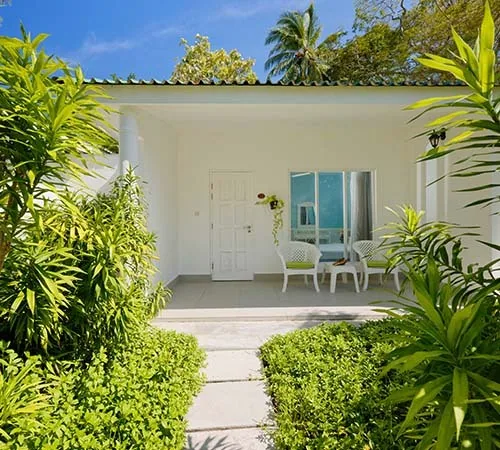 Equator Village, aerial, Seenu (Addu) Atoll, Maldives, Equator Village, the Gan island geometry in Seenu (Addu) Atoll with 80-villa land-based budget dive-focused all-inclusive configuration; country's southernmost canonical-list resort and only canonical-list direct-flight-accessed property via on-island Gan International Airport.