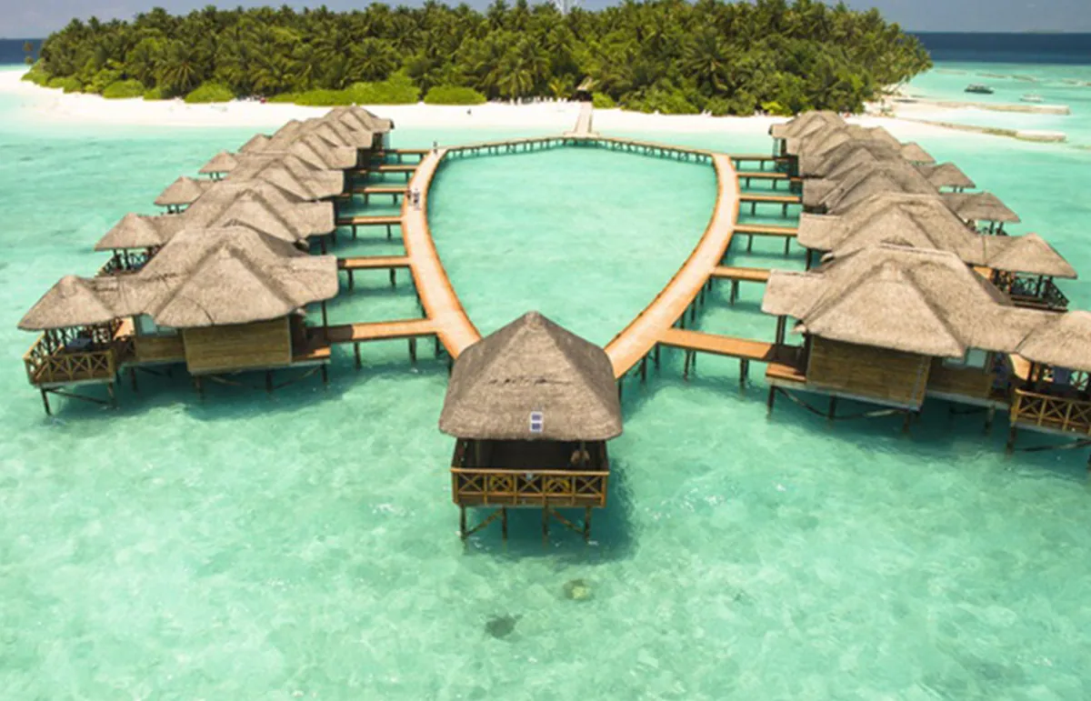Fihalhohi Island Resort, aerial, South Malé Atoll, Maldives, Fihalhohi Island Resort, the Fihalhohi island geometry in southern South Malé Atoll with the over-water cluster on the lagoon side and the perimeter beach configuration.