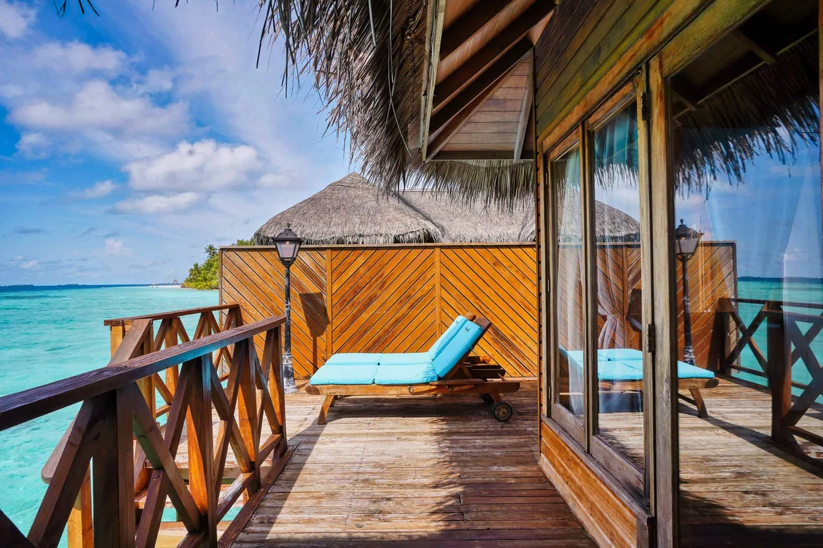 Fihalhohi Island Resort, villa overwater, South Malé Atoll, Maldives, Water Bungalow at the lagoon-side jetty configuration.