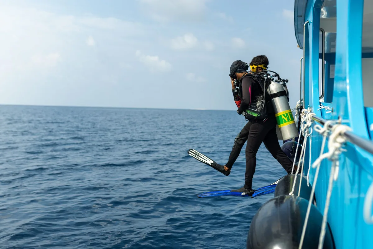 Fihalhohi Island Resort, activity, South Malé Atoll, Maldives, Dive school at the boat-dispatch configuration for South Malé cohort dive-cluster routing including the Kuda Giri wreck.