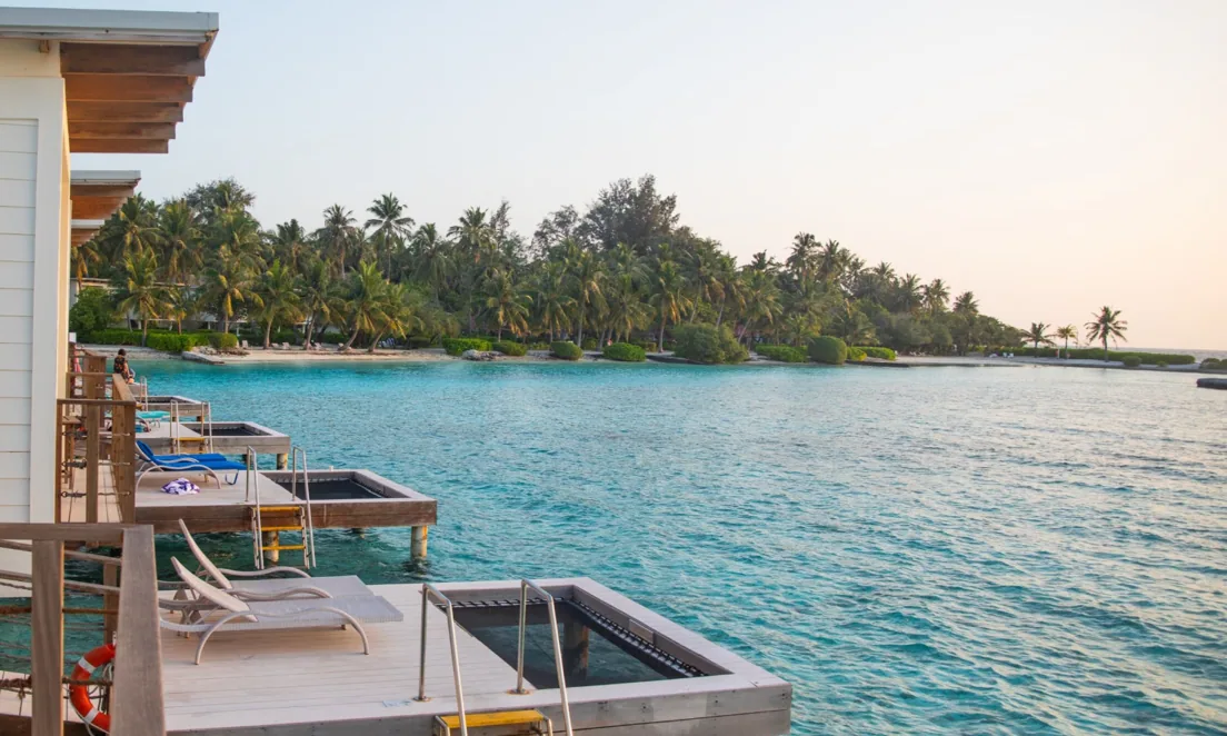 Holiday Inn Resort Kandooma Maldives, aerial, South Malé Atoll, Maldives, Holiday Inn Resort Kandooma Maldives, the Kandooma island geometry in southern South Malé Atoll with the over-water cluster on the lagoon side and the Kandooma Right reef break peeling off the southern edge.