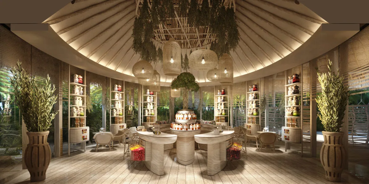 JOALI BEING, spa, Raa Atoll, Maldives, AKTAR herbology centre, circular apothecary room with hanging woven-cane lanterns, suspended herb garlands and apothecary jars on radial shelves, central preparation table where the resident herbologist mixes personalised tonics and teas. Two MICHELIN Keys (2025).