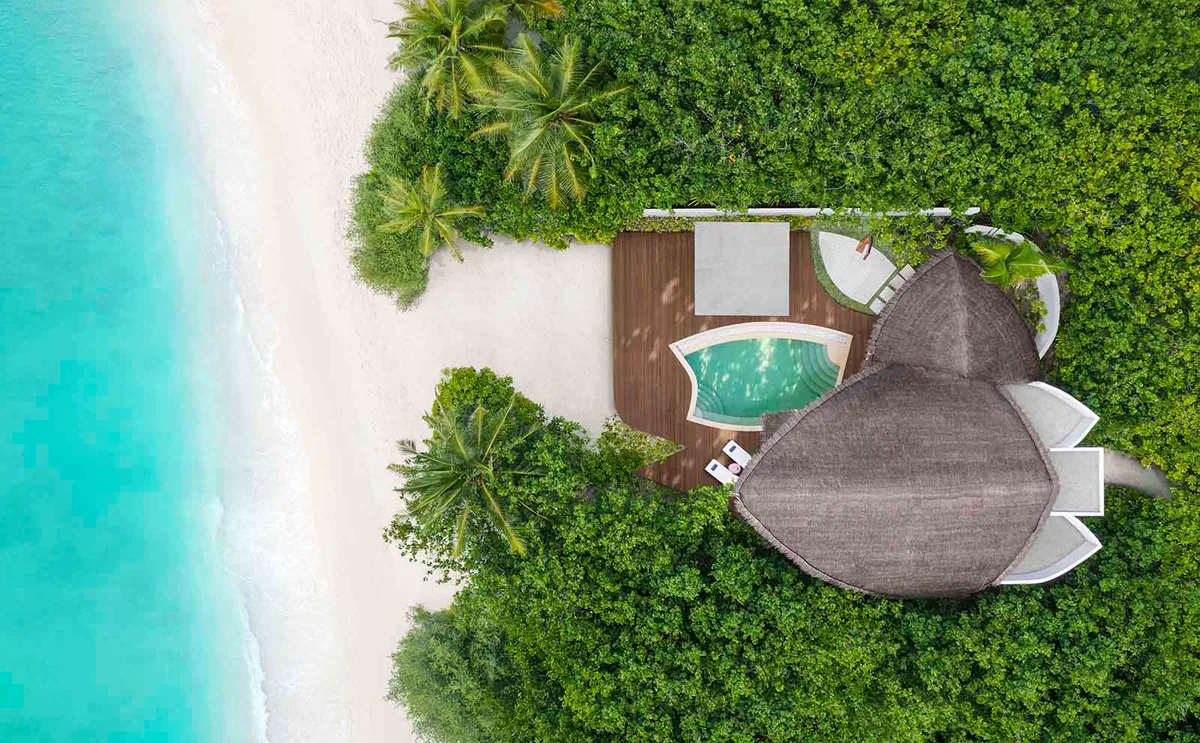 JW Marriott Maldives Resort & Spa, Beach Pool Villa top-down with segmented-petal thatched roof, Shaviyani Atoll, Maldives