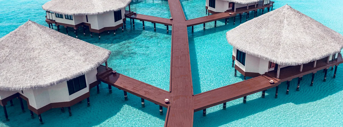 Kihaa Maldives, aerial, Baa Atoll, Maldives, Kihaa Maldives, the natural-island Kihaadhuffaru geometry in northern Baa Atoll UNESCO Biosphere Reserve with the over-water jetty cluster.