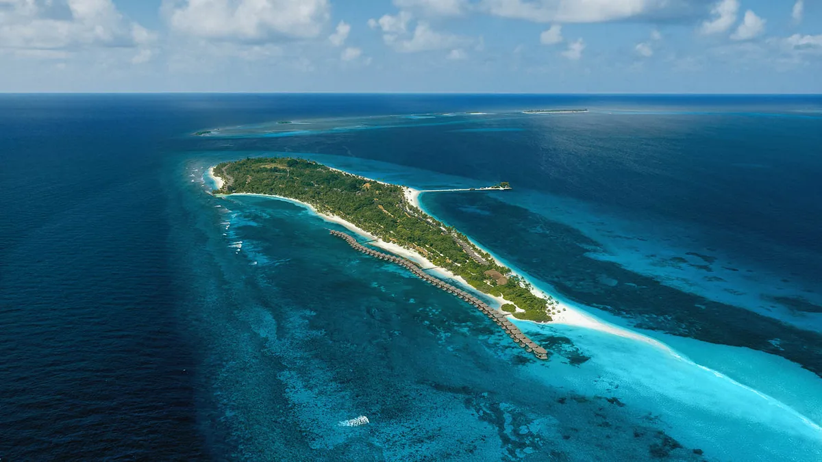 Kuredu Resort Maldives, aerial, Lhaviyani Atoll, Maldives, Kuredu Resort Maldives, the 1.8-kilometre longer-axis Kuredu island in central Lhaviyani Atoll with the over-water jetty cluster.