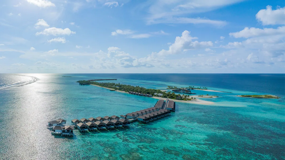 Le Méridien Maldives Resort & Spa, aerial, Lhaviyani Atoll, Maldives, Le Méridien Maldives Resort & Spa, the natural-island Thilamaafushi geometry in central Lhaviyani Atoll with the over-water jetty cluster.