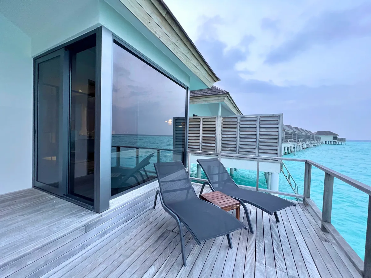 Le Méridien Maldives Resort & Spa, villa overwater, Lhaviyani Atoll, Maldives, Sunset Overwater Villa with the Le Méridien French-coastal design vocabulary.