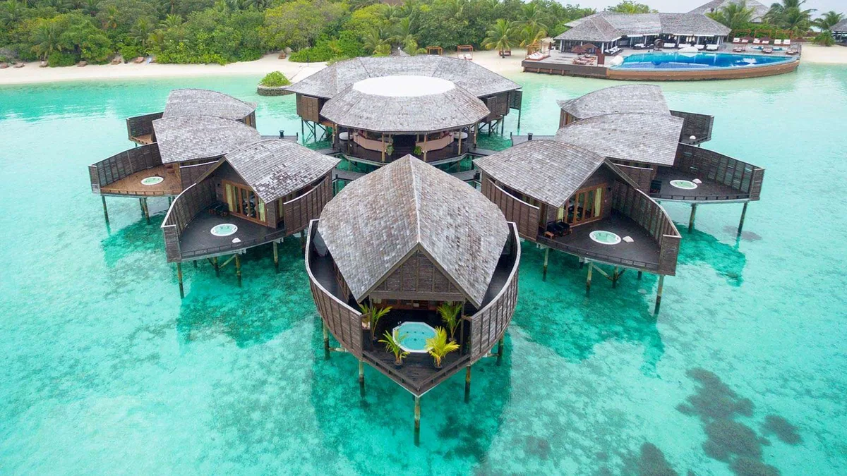 Lily Beach Resort & Spa, spa, Alif Dhaal (South Ari) Atoll, Maldives, Tamara Spa overwater cluster aerial with the five gabled cedar-shingle pavilions in radial geometry around the central reception pavilion.