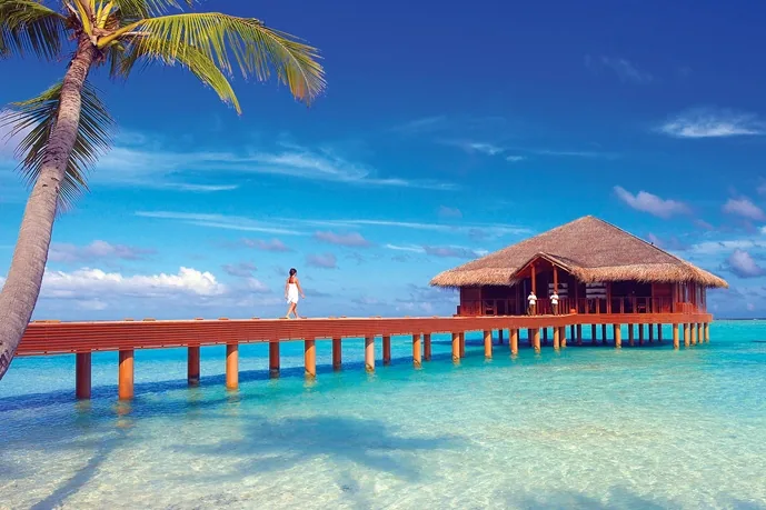 Medhufushi Island Resort, aerial, Meemu Atoll, Maldives, Medhufushi Island Resort, the natural-island Medhufushi geometry in southern central Meemu Atoll with the over-water jetty cluster.