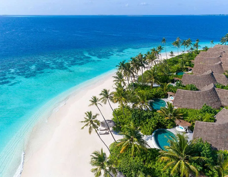 Milaidhoo Island Maldives, aerial, Baa Atoll, Maldives, Milaidhoo Island Maldives, the small natural-island geometry in northern Baa Atoll UNESCO Biosphere Reserve with the Ba'theli over-water dhoni-pavilion at the central jetty configuration.