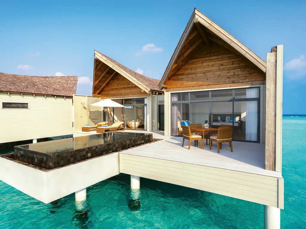 Mövenpick Resort Kuredhivaru, Overwater Pool Villa exterior with A-frame timber gable and dark-mosaic pool, Noonu Atoll, Maldives