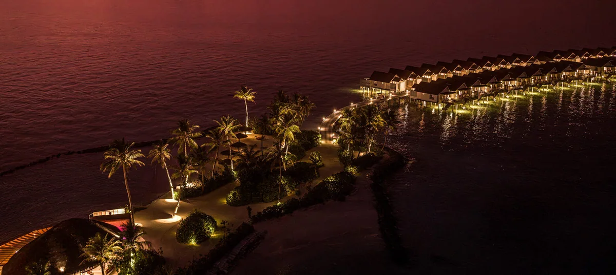 OBLU SELECT Lobigili, aerial, North Malé Atoll, Maldives, OBLU SELECT Lobigili, the Lobigili island geometry on the eastern edge of North Malé Atoll with the all-over-water jetty cluster arrangement and no beach-villa inventory by deliberate design.