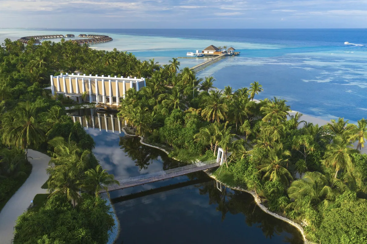Pullman Maldives Maamutaa, aerial, Gaafu Alifu Atoll, Maldives, Pullman Maldives Maamutaa, the Maamutaa island geometry in Gaafu Alifu Atoll with the two-section single-property arrangement: main-property villa cluster + dedicated adults-only Hideaway sub-section at the separate-zone within the single-island configuration.