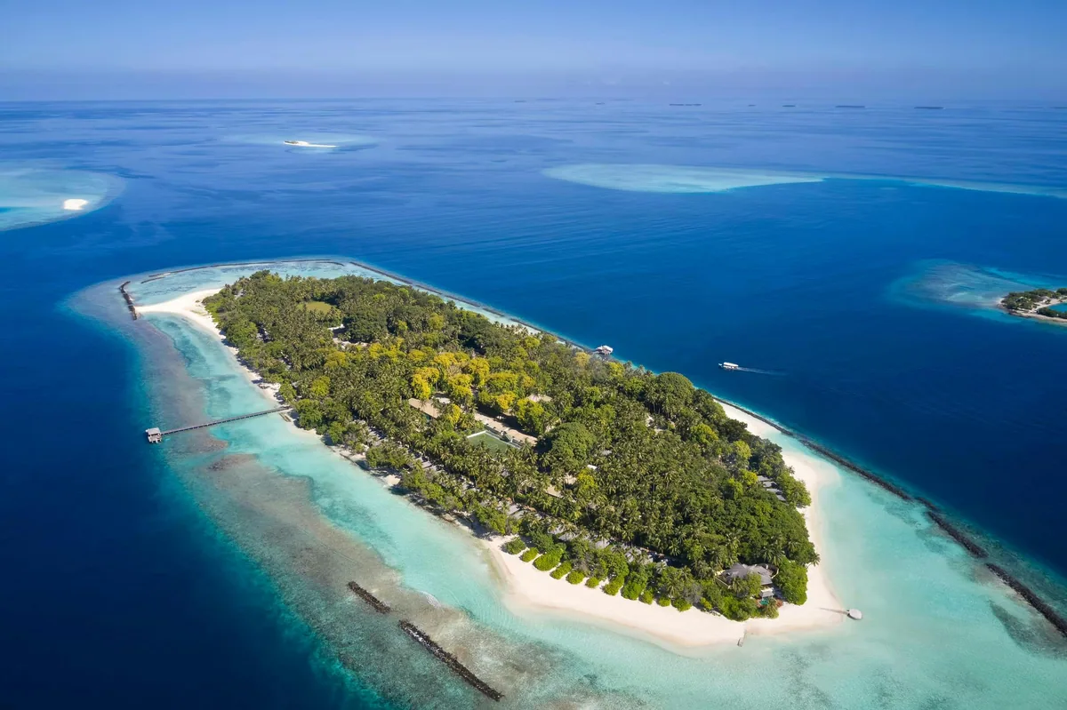 Royal Island Resort & Spa, aerial, Baa Atoll, Maldives, Royal Island Resort & Spa, the natural-island Horubadhoo geometry in northern Baa Atoll UNESCO Biosphere Reserve.