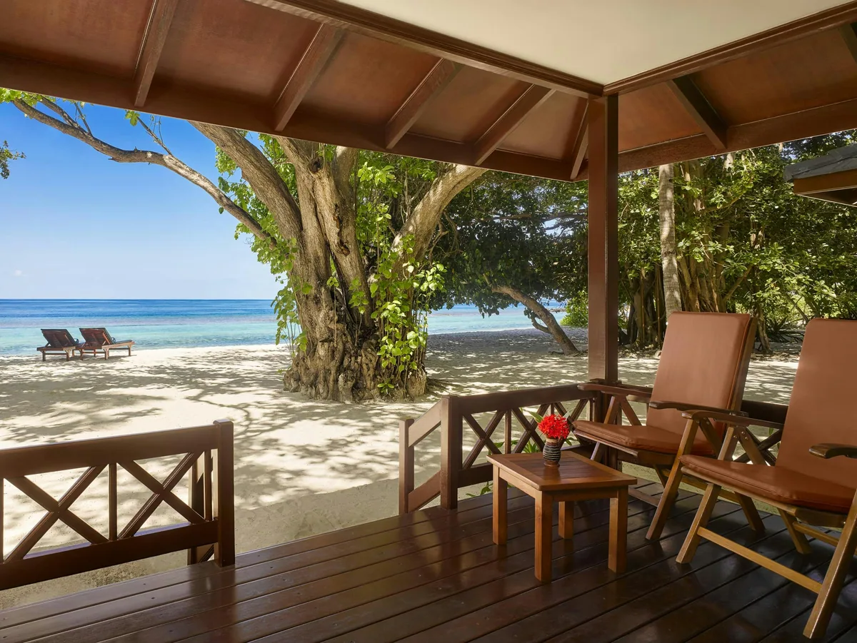 Royal Island Resort & Spa, villa beach, Baa Atoll, Maldives, Deluxe Beach Villa with the thatched-roof natural-material finishes and sala-style outdoor configuration.