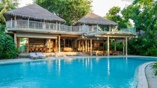 Seven-bedroom Sunset Reserve beachfront residence facing west across the lagoon at Soneva Fushi.