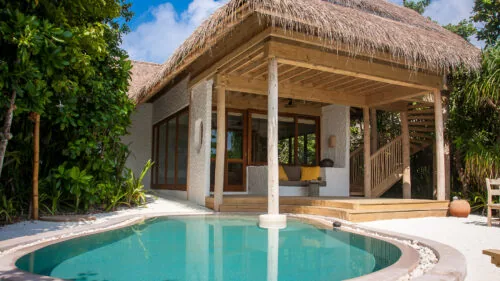 Family Villa Suite with private pool at Soneva Fushi, configured for two adults and two children.