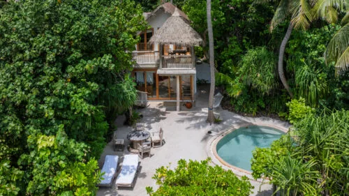 Villa 29 two-bedroom Crusoe with private pool, thatched roof and dense jungle surround at Soneva Fushi.