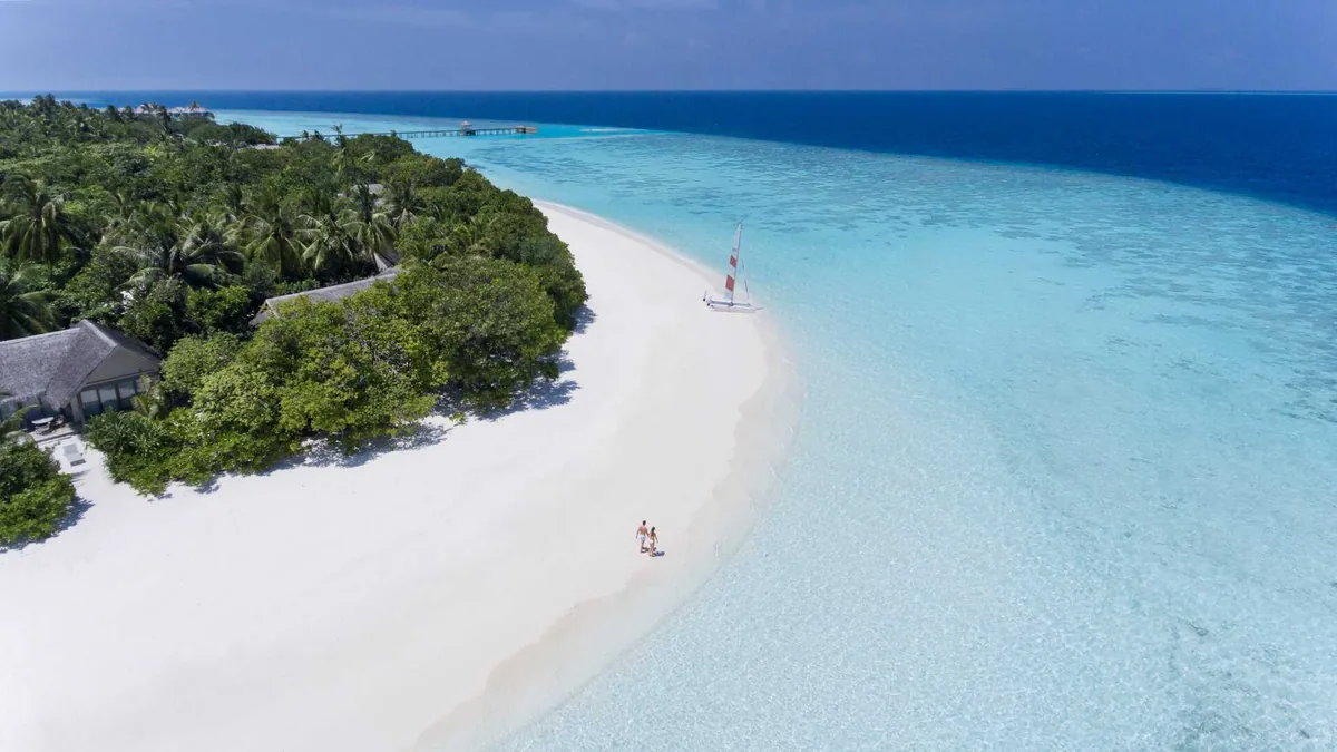 Vakkaru Maldives, aerial, Baa Atoll, Maldives, Vakkaru Maldives, the natural-island Vakkaru geometry in central Baa Atoll UNESCO Biosphere Reserve with the over-water jetty cluster.